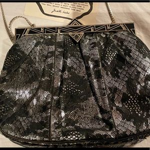 Judith Leiber black lace with silver underlay evening bag. Vintage